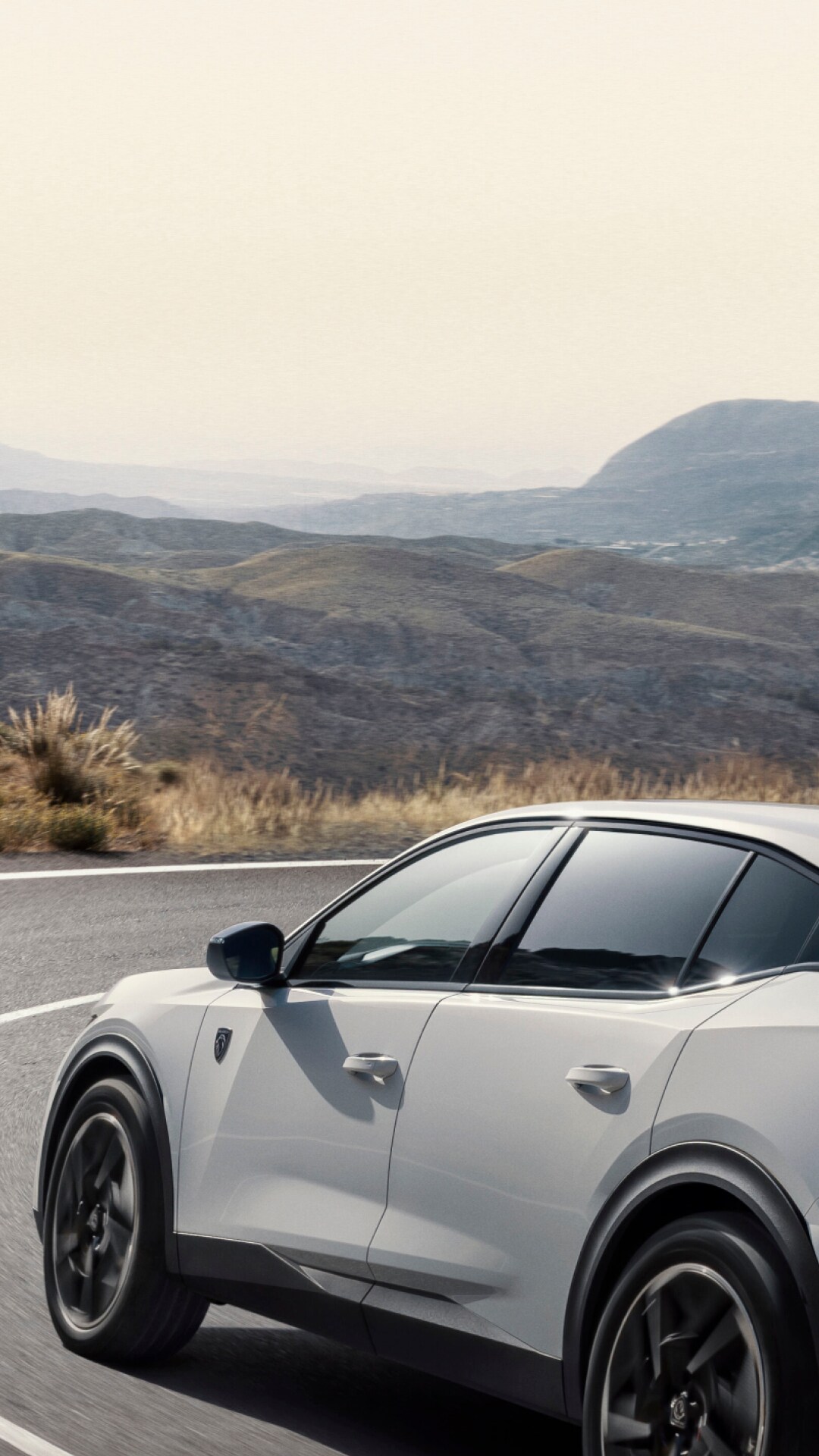 PEUGEOT E-408 on a mountain road